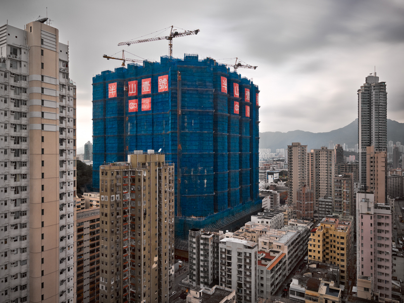 Illustration for article titled The Surreal Sight of Skyscrapers Encased in Colored Fabric